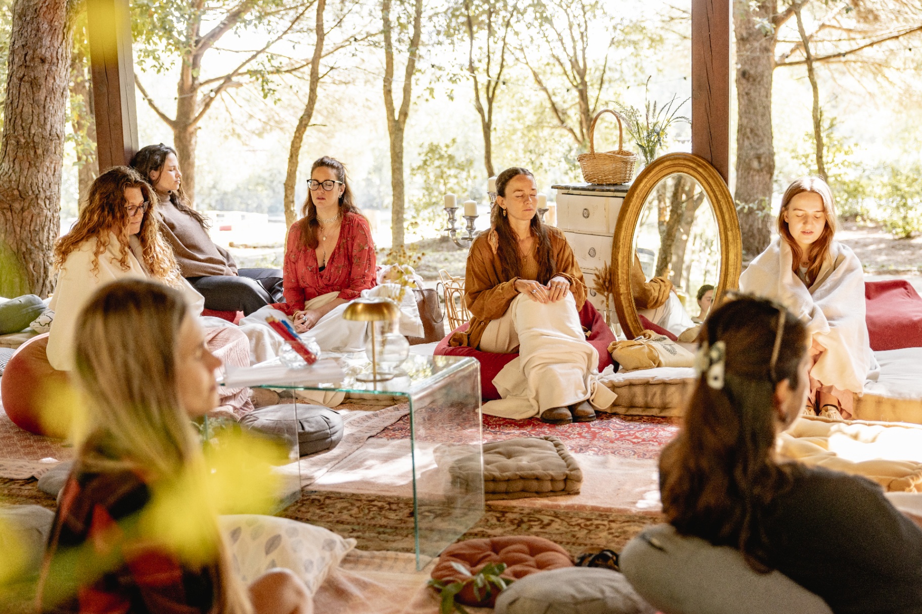 Group meditation circle in the forest pavilion