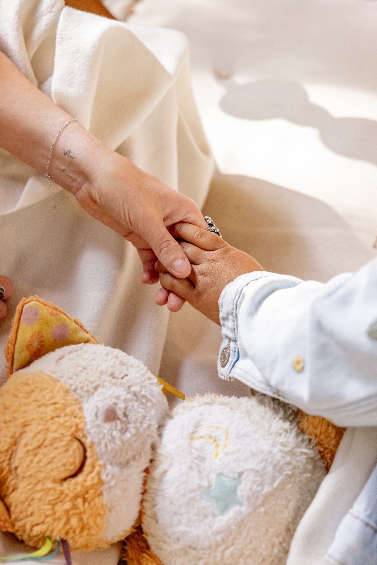 Mother and child holding hands