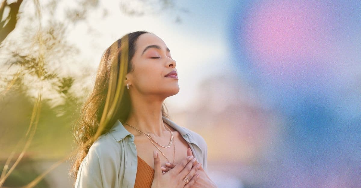 Woman with hands on chest - Connecting Through Technology for mental wellness